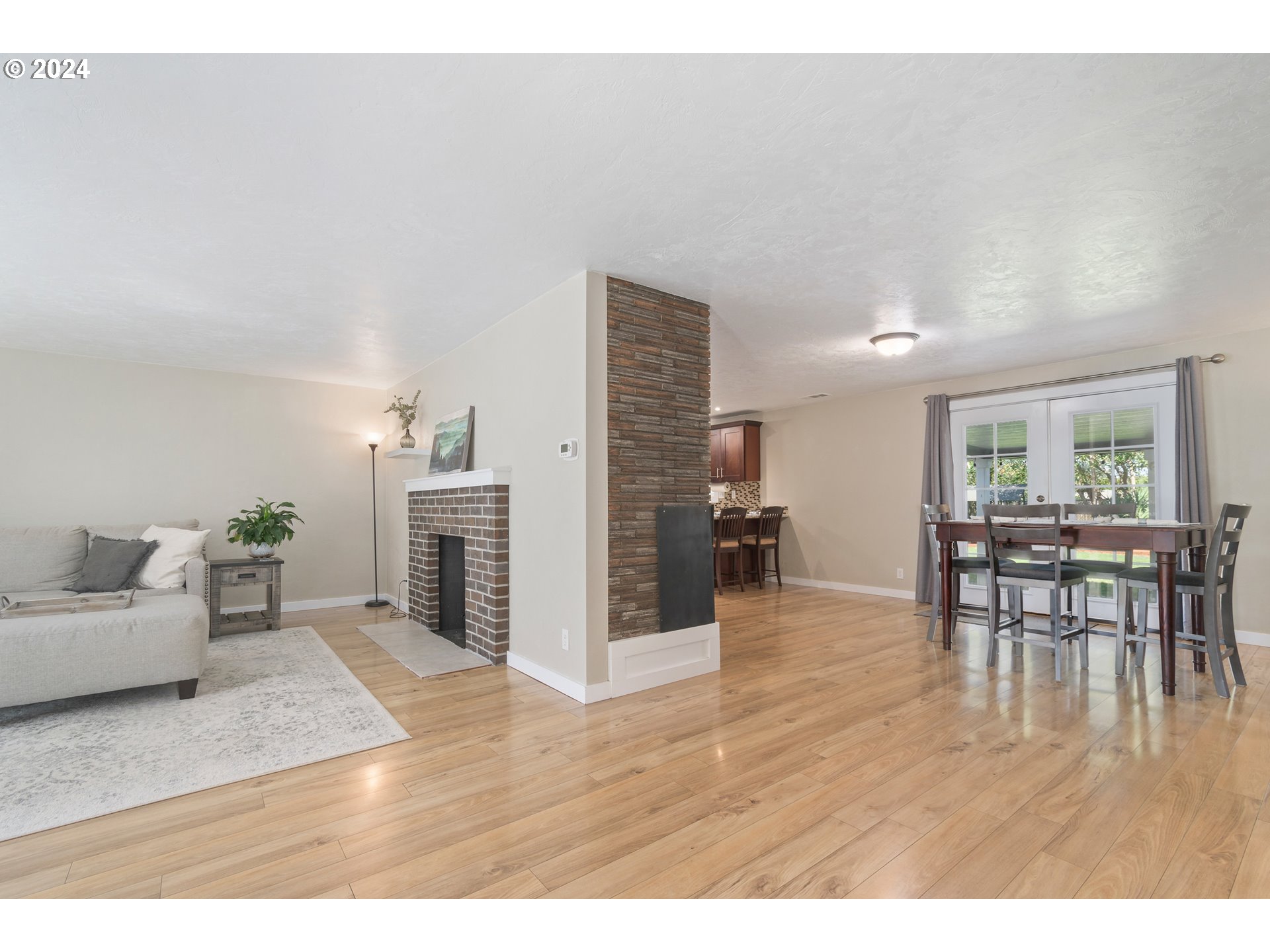 273 West Anchor Avenue Eugene, OR 97404 - Photo 5 of 43 a living room with furniture and a wooden floor