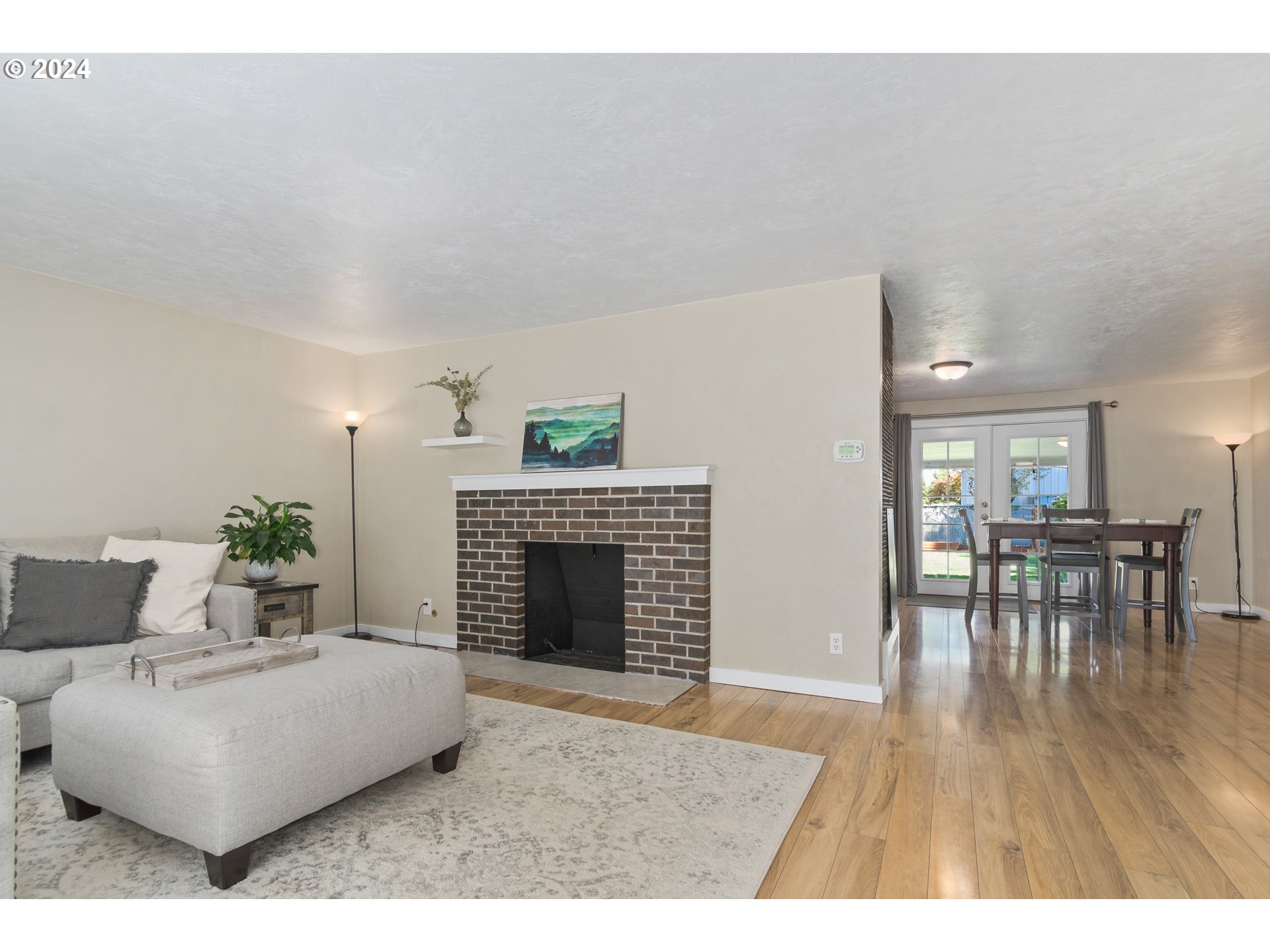 273 West Anchor Avenue Eugene, OR 97404 - Photo 7 of 43 a living room with furniture and a fireplace