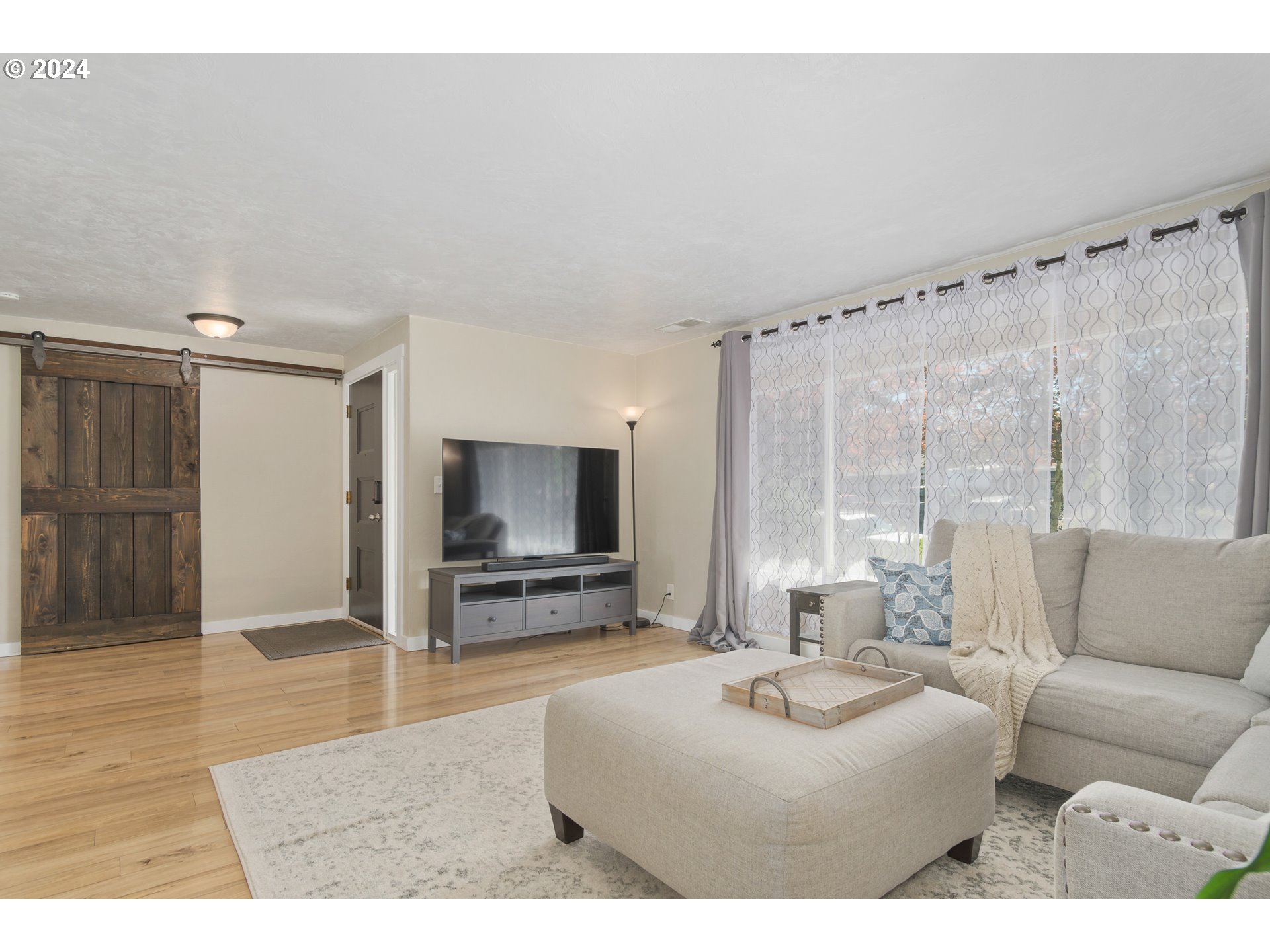 273 West Anchor Avenue Eugene, OR 97404 - Photo 8 of 43 a living room with furniture and a flat screen tv