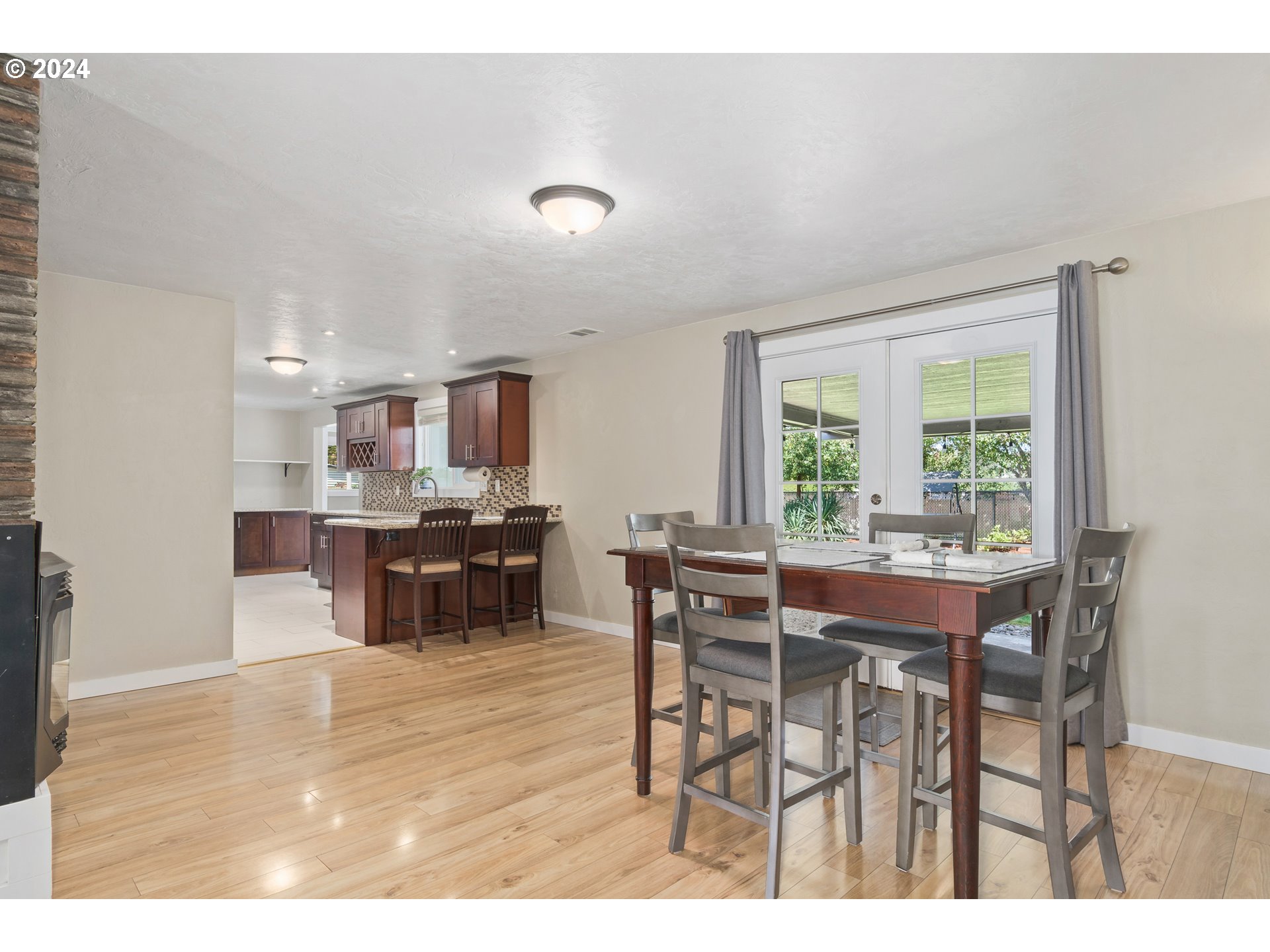 273 West Anchor Avenue Eugene, OR 97404 - Photo 10 of 43 a view of a dining room with furniture and a large window