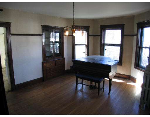 584 Centre Street Boston, MA 02130 - Photo 14 of 26 a view of a room with furniture window and wooden floor