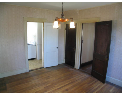 584 Centre Street Boston, MA 02130 - Photo 16 of 26 a view of a room with wooden floor and staircase