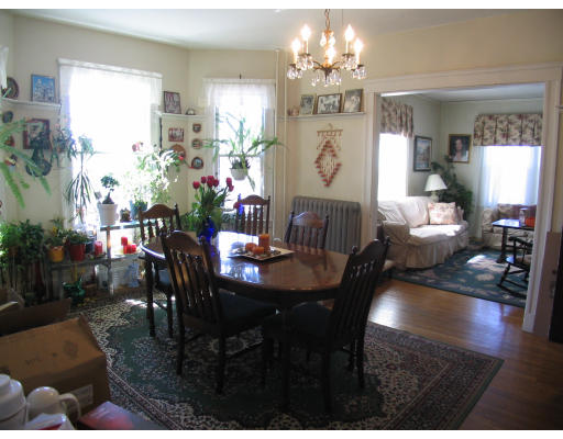 584 Centre Street Boston, MA 02130 - Photo 24 of 26 a view of a dining room with furniture and chandelier