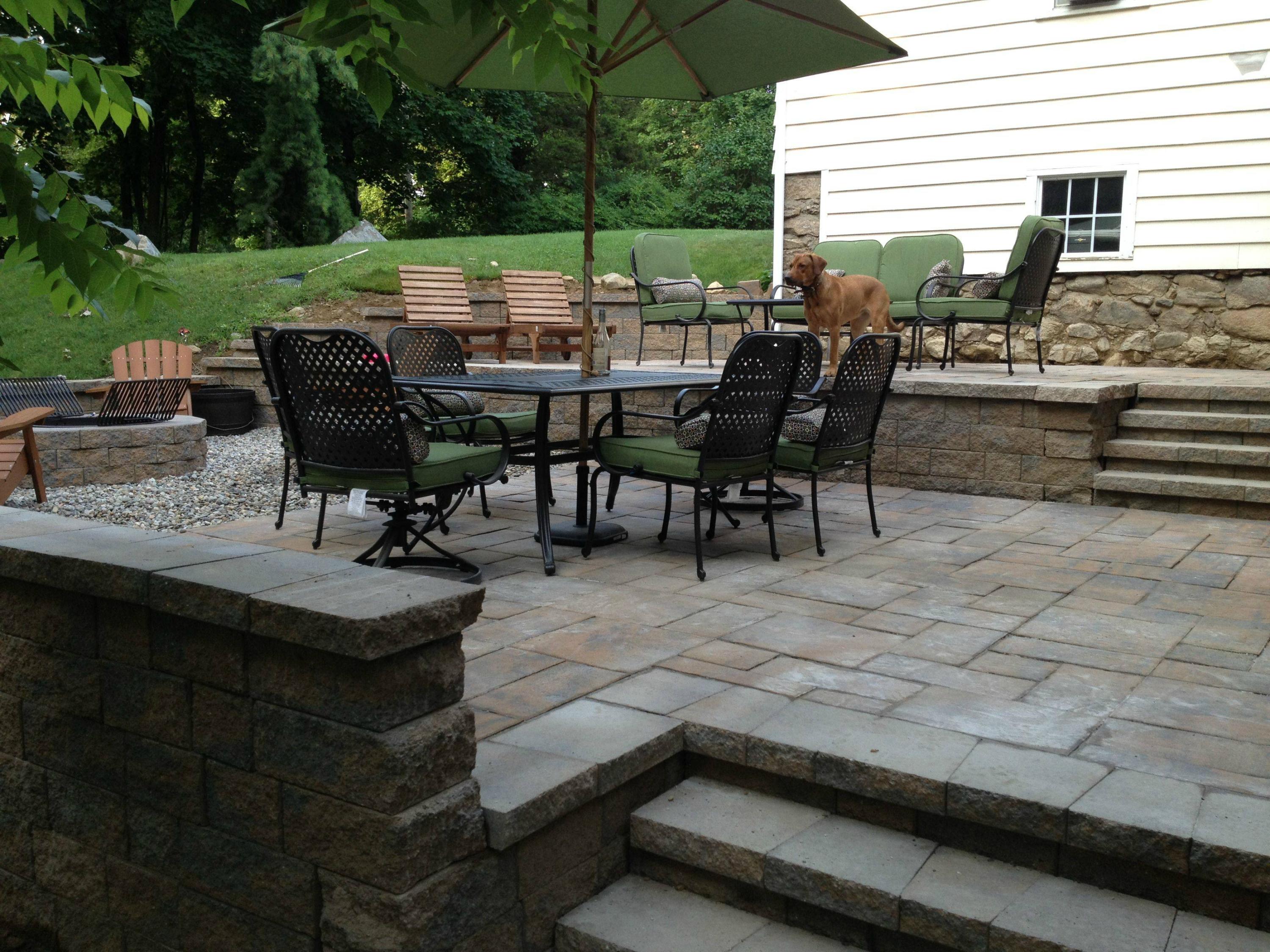 296 Belden Hill Road Wilton, CT 06897 - Photo 16 of 18 a view of a patio with table and chairs and potted plants