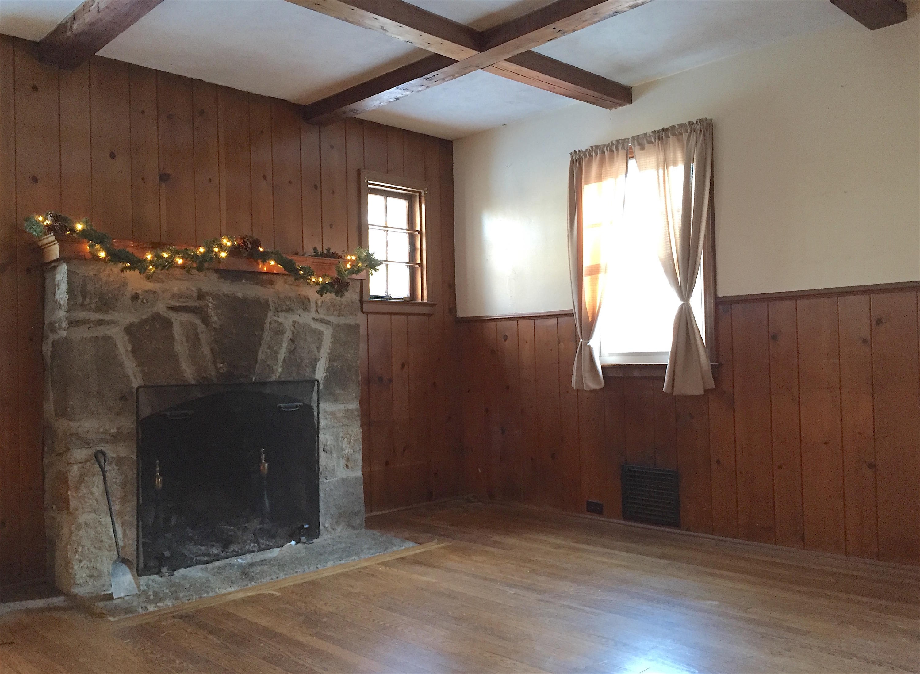 296 Belden Hill Road Wilton, CT 06897 - Photo 3 of 18 an empty room with wooden floor mirror and windows