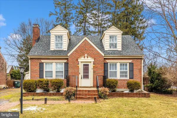 a front view of a house with yard
