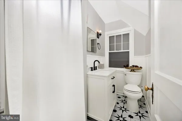 a bathroom with a toilet and a sink