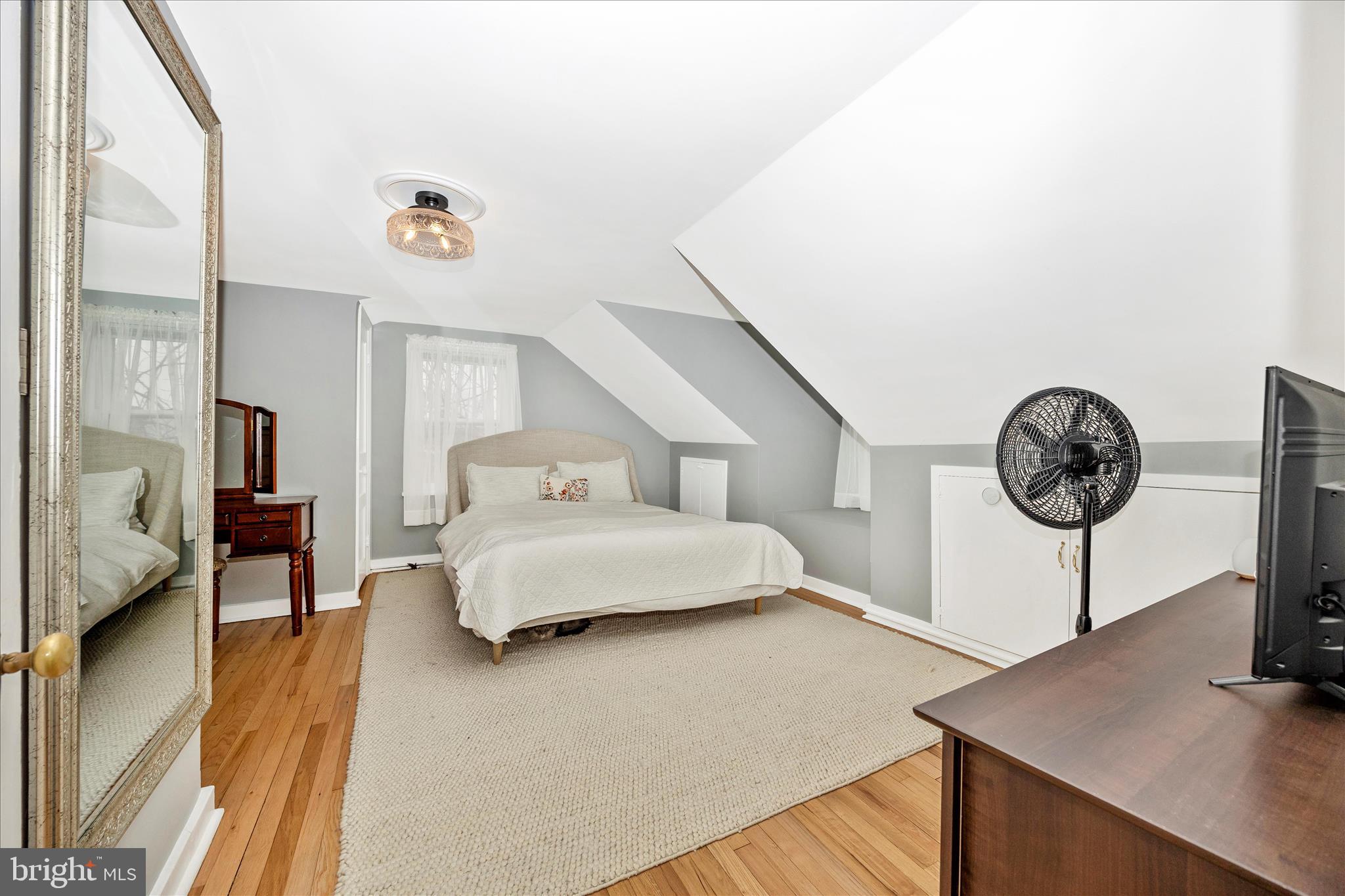 633 Lee Place Frederick, MD 21702 - Photo 19 of 48 a spacious bedroom with a bed and a table in it
