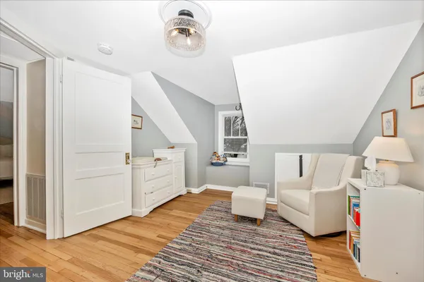 a spacious bedroom with a bed and a couch