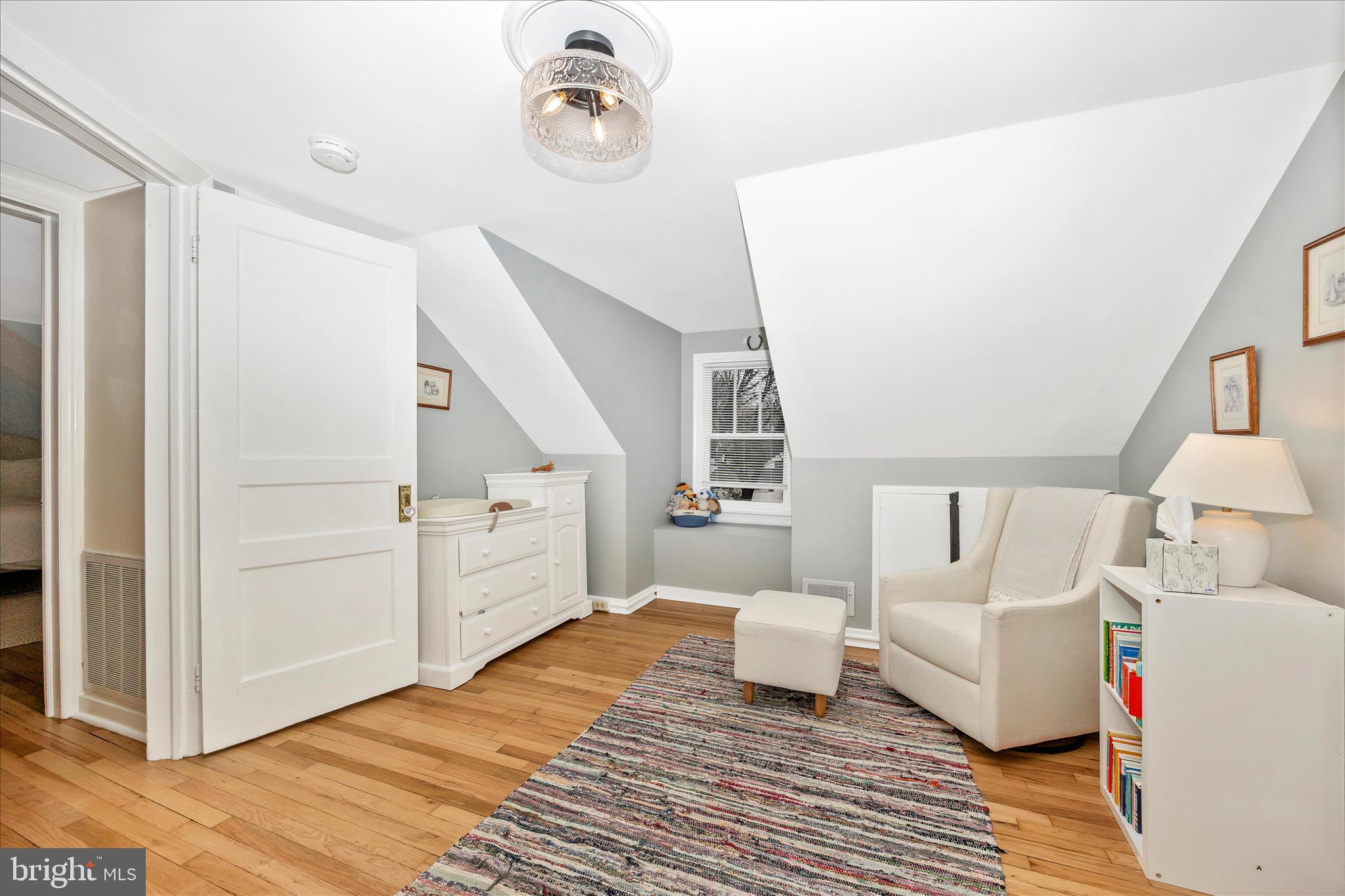 633 Lee Place Frederick, MD 21702 - Photo 25 of 48 a spacious bedroom with a bed and a couch