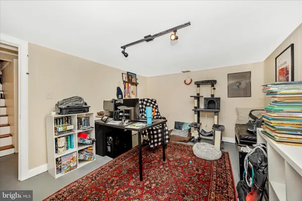 a view of a workspace with furniture and workspace