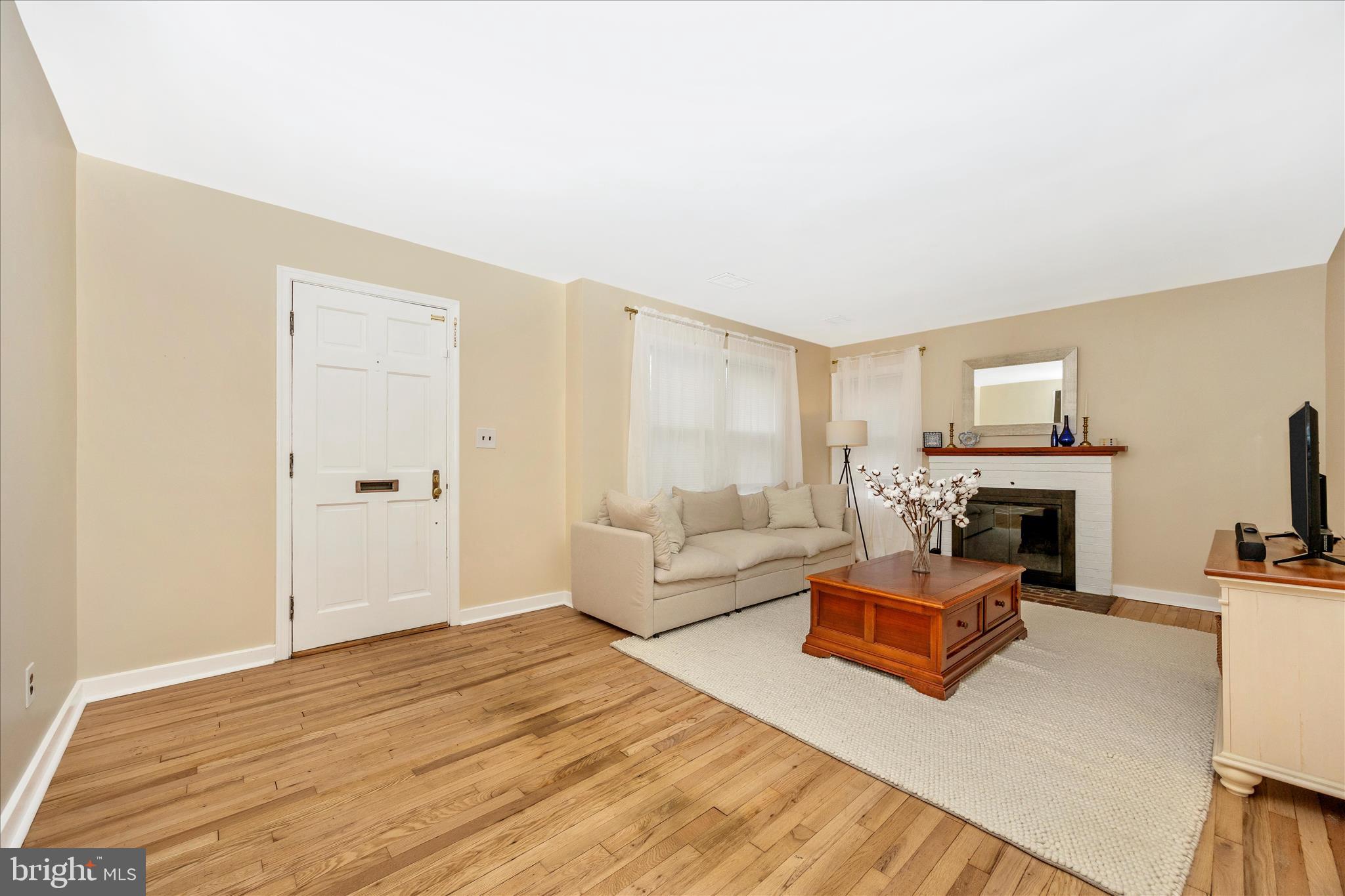 633 Lee Place Frederick, MD 21702 - Photo 5 of 48 a living room with furniture and a fireplace