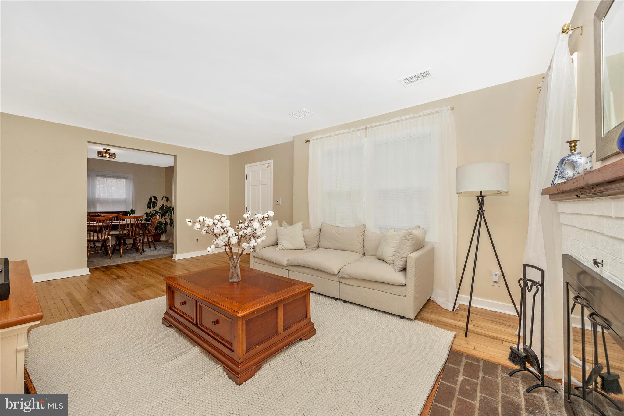 633 Lee Place Frederick, MD 21702 - Photo 6 of 48 a living room with furniture a fireplace and a flat screen tv