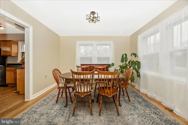 a view of a dining room with furniture and window