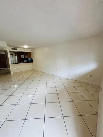 a view of a livingroom with kitchen