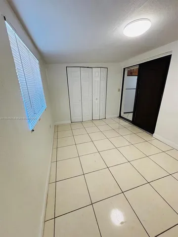 a bathroom with a shower and a bathtub