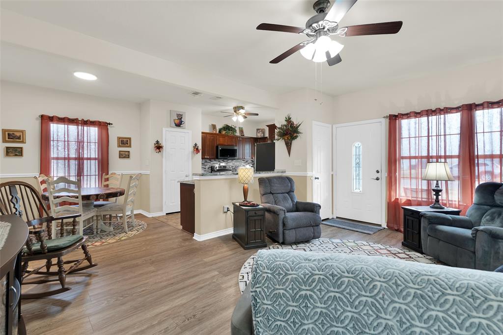 201 East Walker Street Denison, TX 75021 - Photo 3 of 19 a living room with furniture fireplace and window
