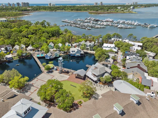 an aerial view of a houses with ocean view
