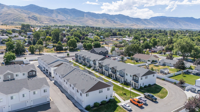 46 West 460 Smithfield, UT 84335 - Photo 31 of 31 Modern townhome development featuring multiple units, paved parking areas, and manicured green spaces