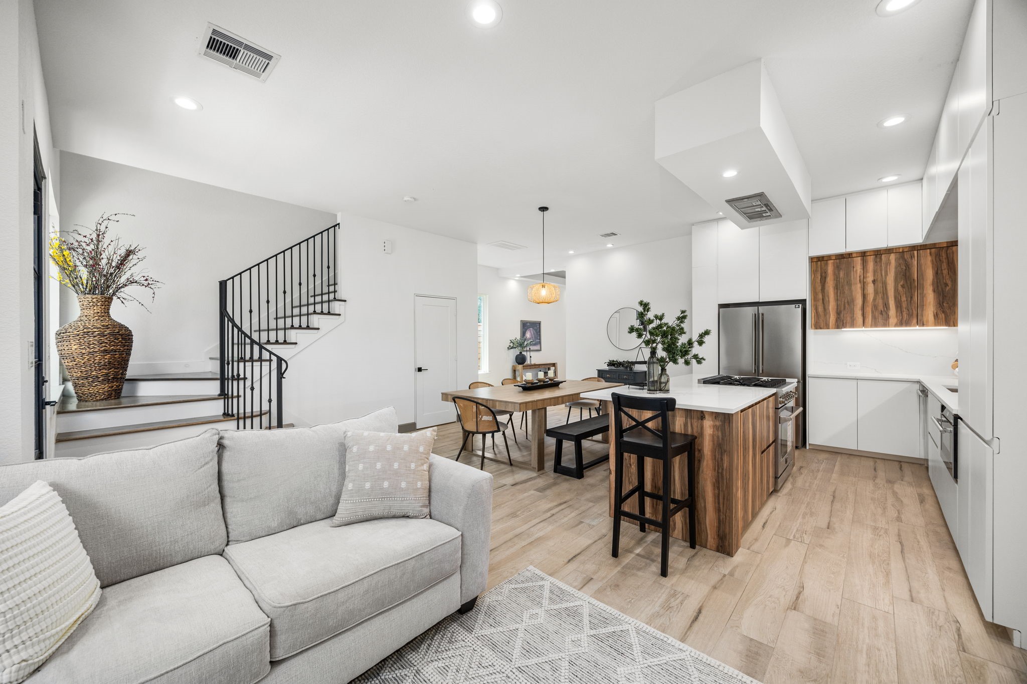 7934 Hennessy Lane, Unit 5 Spring, TX 77389 - Photo 19 of 36 a living room with furniture a rug and white walls