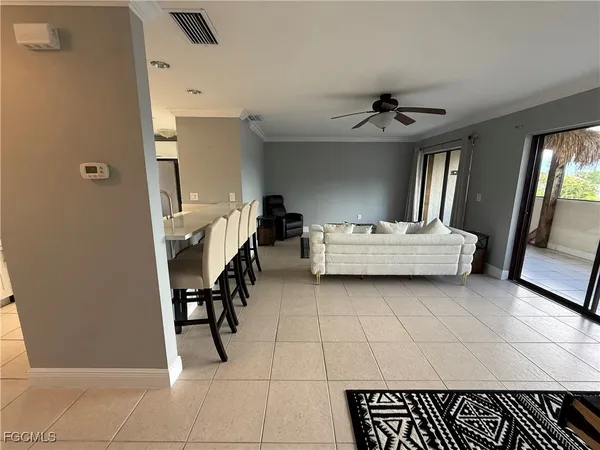 a living room with furniture and a rug