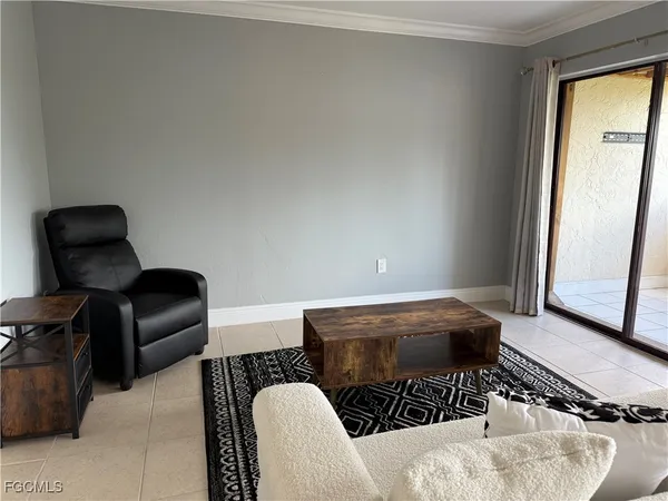 a bedroom with a bed and a chair