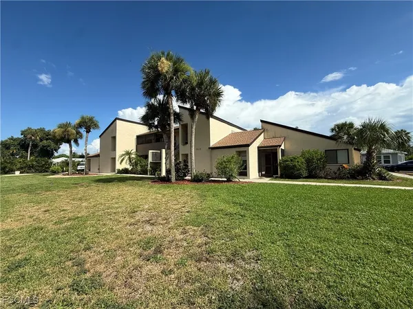 a front view of house with yard and green space