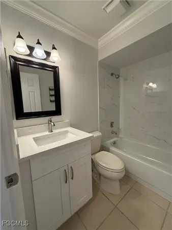 a bathroom with a toilet sink vanity and mirror