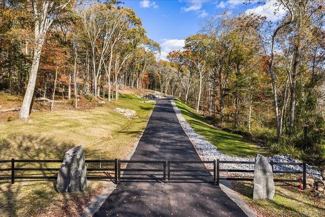 a view of swimming pool with outdoor seating and trees