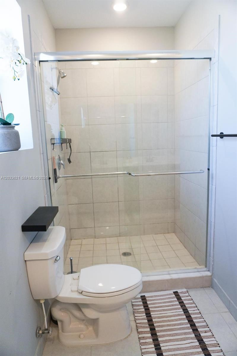 11942 Southwest 243rd Street Homestead, FL 33032 - Photo 19 of 50 a bathroom with a toilet and a shower