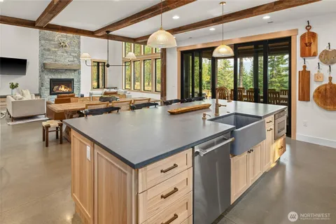 a kitchen with a stove a sink and a refrigerator
