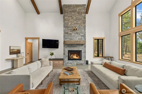 a living room with furniture fireplace and flat screen tv