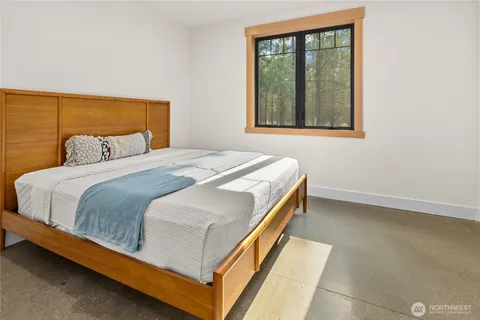 a bedroom with a bed and window