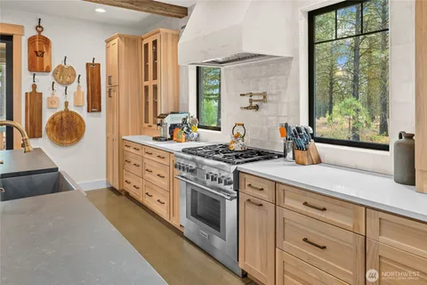 a spacious bathroom with a double vanity sink a mirror a and a shower