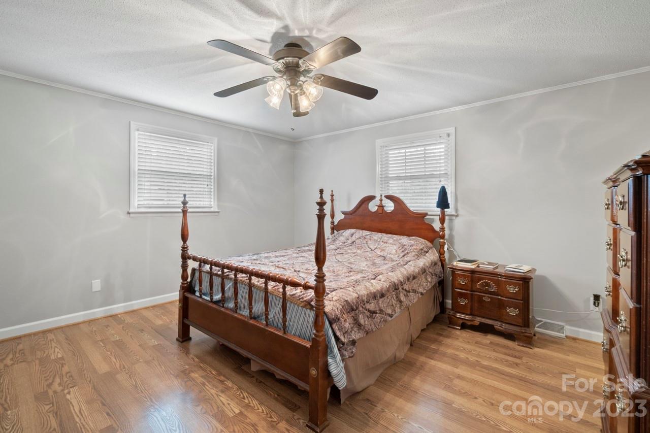 2656 Sandy Ford Road Newton, NC 28658 - Photo 14 of 34 a bed sitting in a bedroom next to a window