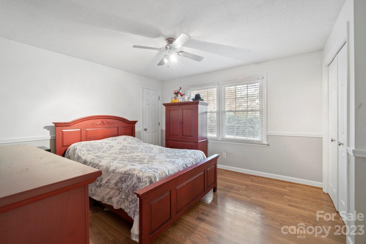 2656 Sandy Ford Road Newton, NC 28658 - Photo 21 of 34 a bed sitting in a bedroom next to a window