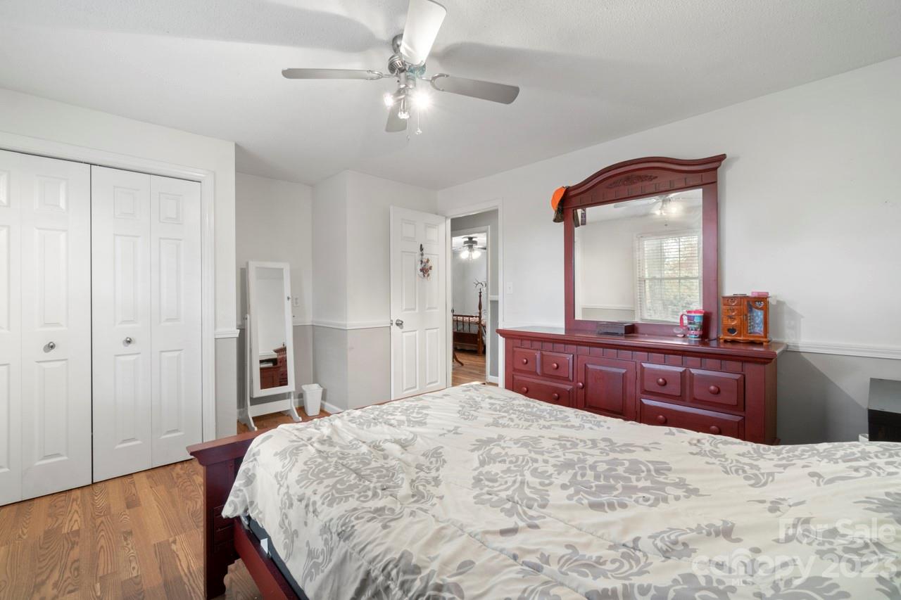2656 Sandy Ford Road Newton, NC 28658 - Photo 22 of 34 a bed room with a bed and a large mirror