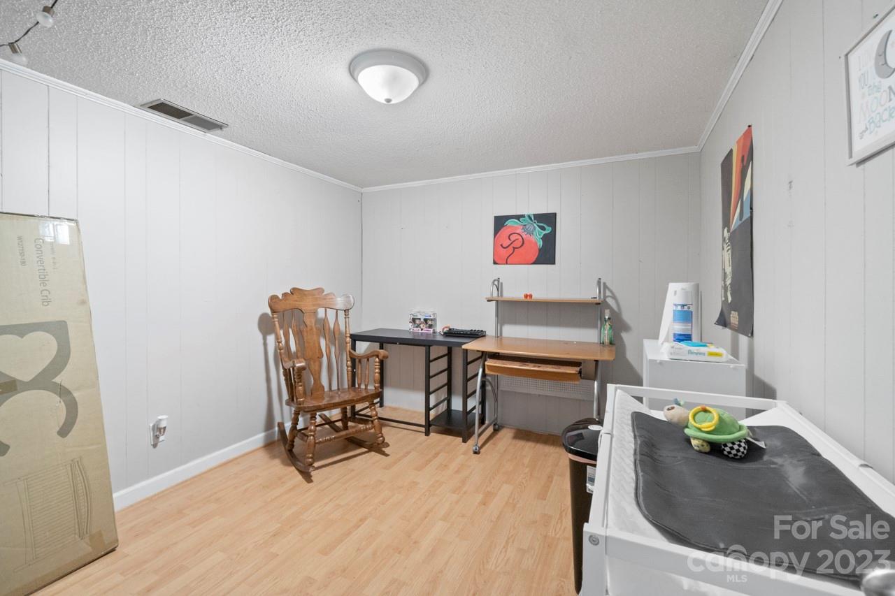 2656 Sandy Ford Road Newton, NC 28658 - Photo 23 of 34 a workspace with furniture and a couch