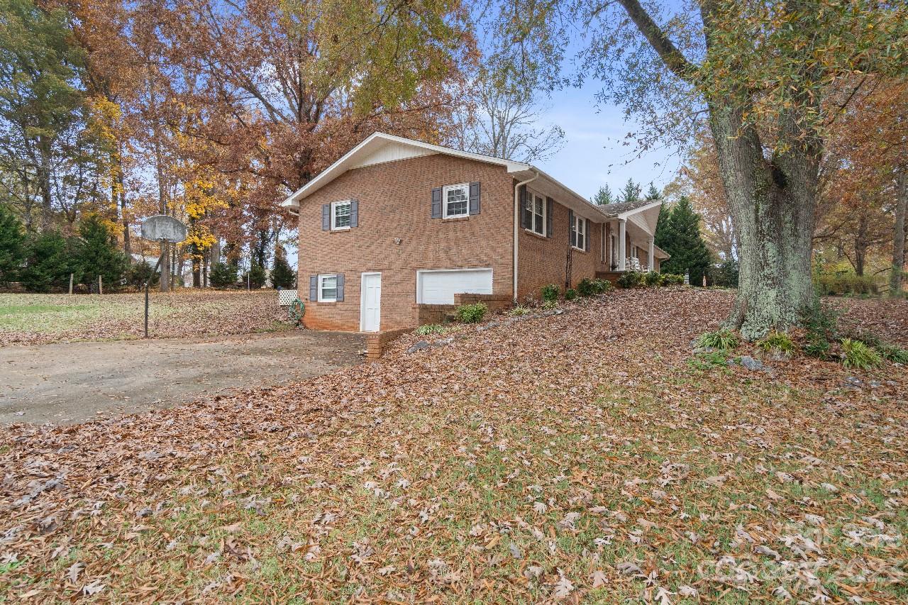 2656 Sandy Ford Road Newton, NC 28658 - Photo 30 of 34 a front view of a house with a yard and garage