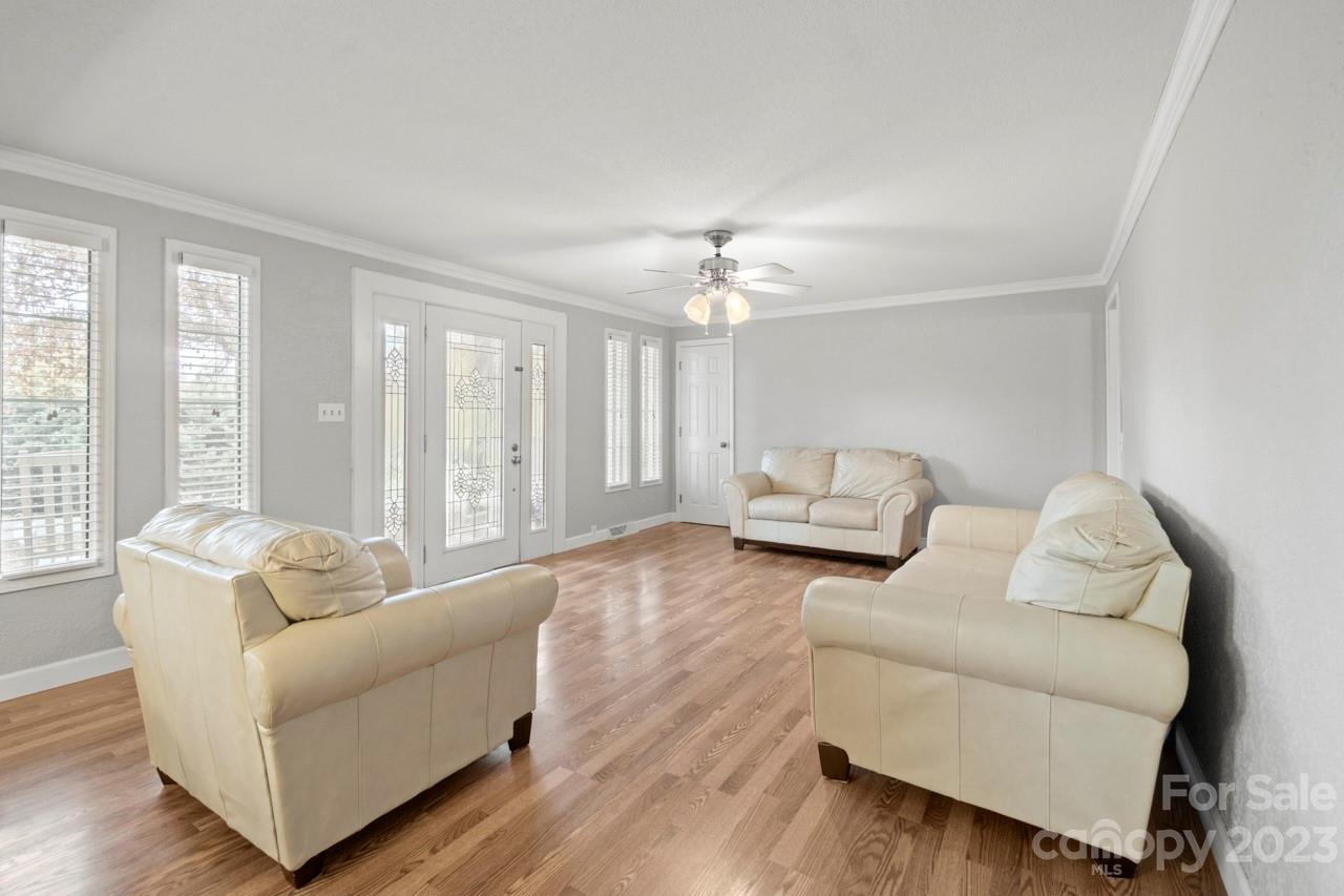 2656 Sandy Ford Road Newton, NC 28658 - Photo 4 of 34 a living room with furniture and a large mirror