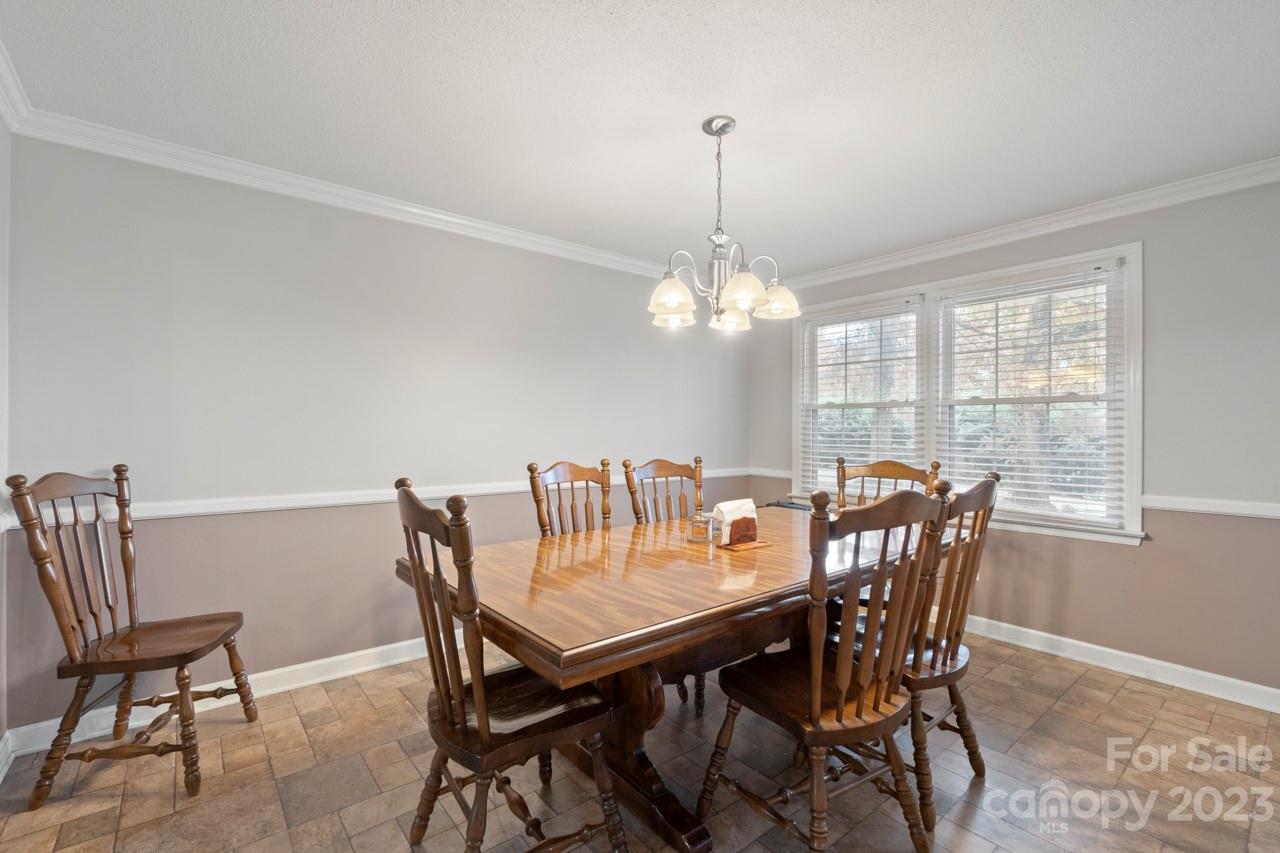 2656 Sandy Ford Road Newton, NC 28658 - Photo 5 of 34 a view of a dining room with furniture window and chandelier