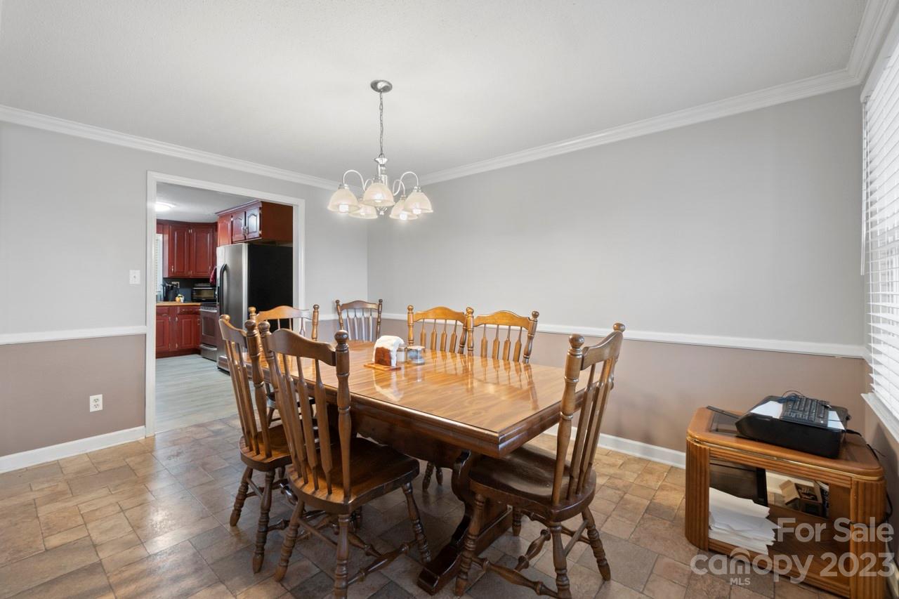 2656 Sandy Ford Road Newton, NC 28658 - Photo 6 of 34 a view of a dining room with furniture and chandelier