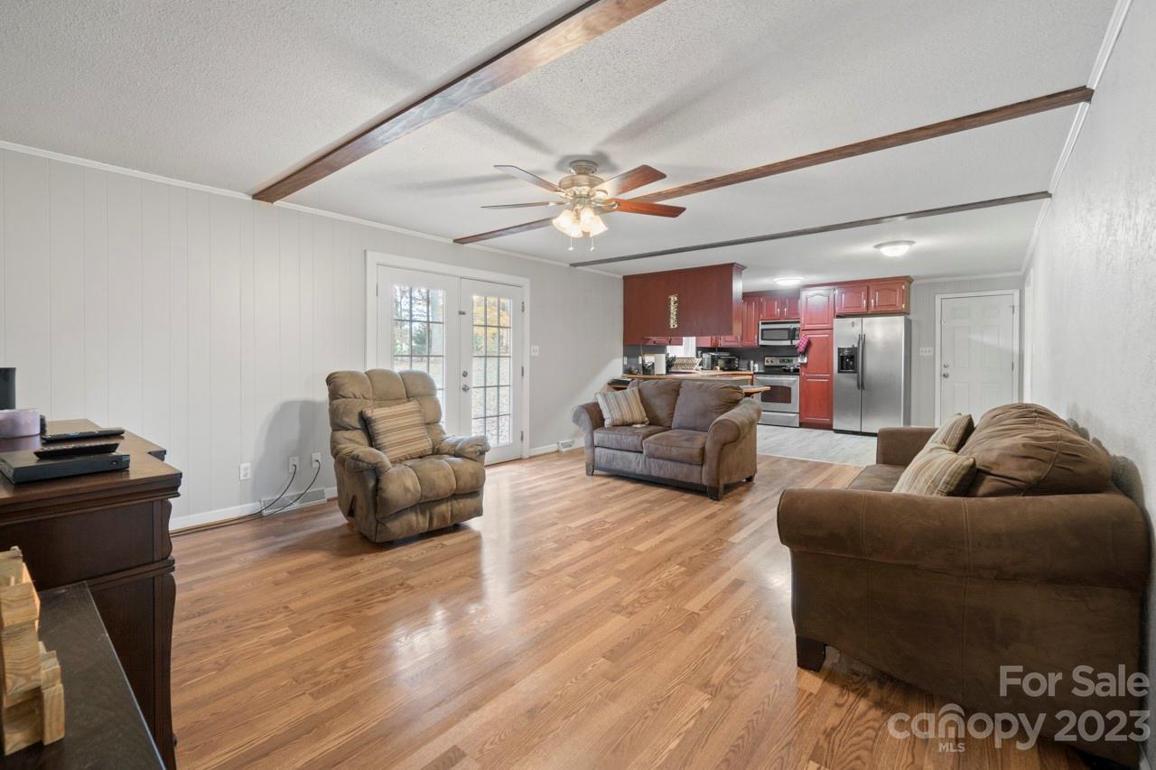 2656 Sandy Ford Road Newton, NC 28658 - Photo 10 of 34 a living room with furniture and a chandelier