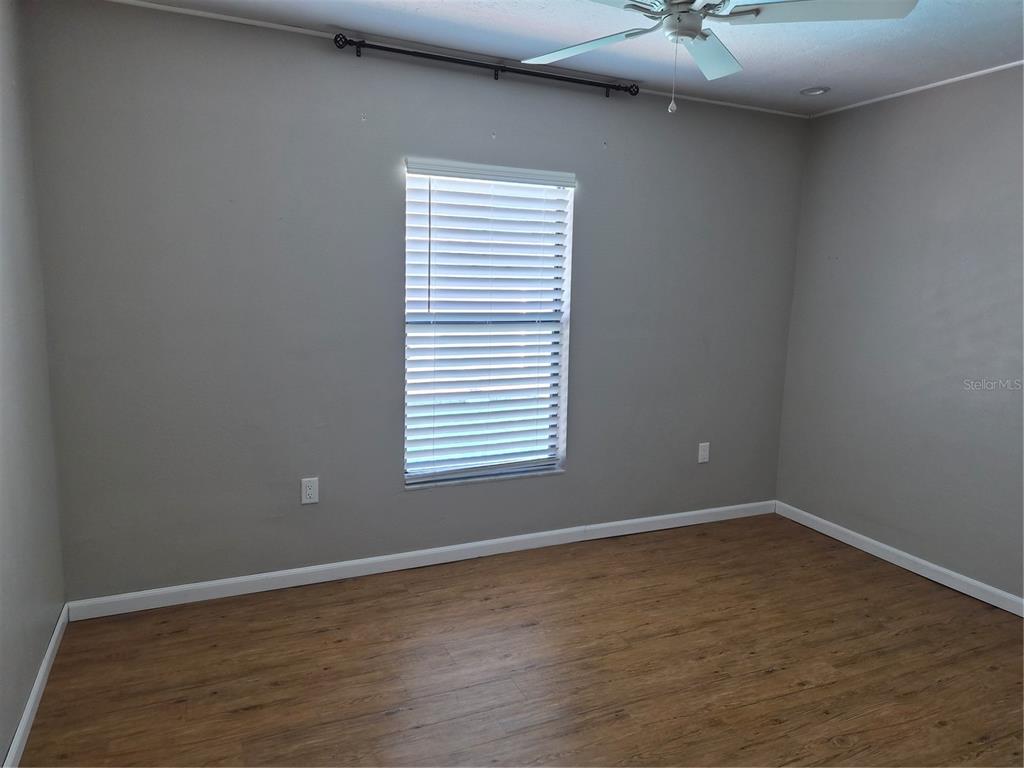 1080 Leeward Road Venice, FL 34293 - Photo 17 of 33 an empty room with a window