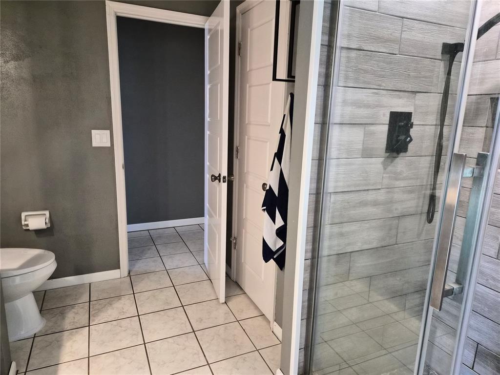1080 Leeward Road Venice, FL 34293 - Photo 23 of 33 a bathroom with a toilet and a shower