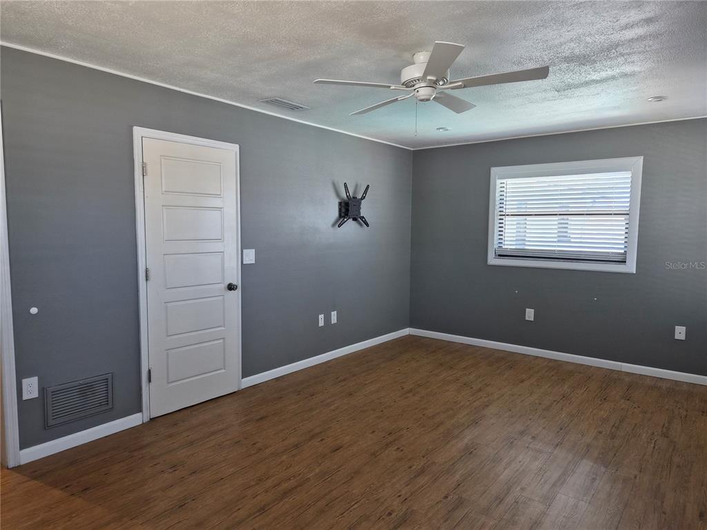 1080 Leeward Road Venice, FL 34293 - Photo 28 of 33 an empty room with fan and windows