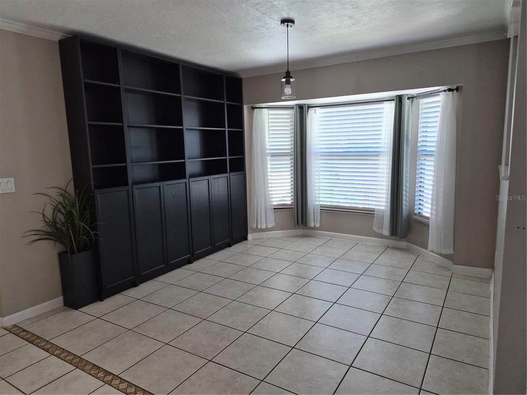1080 Leeward Road Venice, FL 34293 - Photo 4 of 33 a view of an empty room with a window