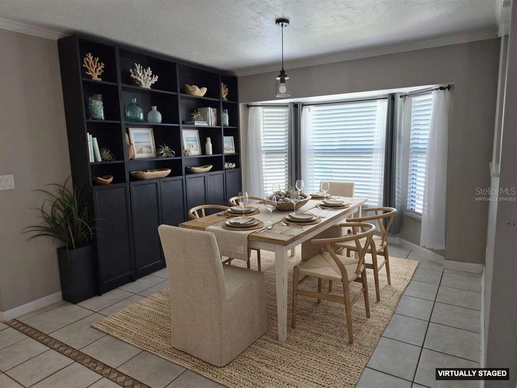 1080 Leeward Road Venice, FL 34293 - Photo 5 of 33 a view of a dining room with furniture and window