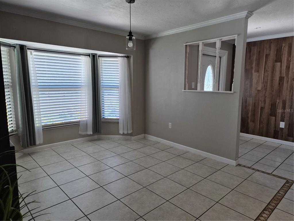1080 Leeward Road Venice, FL 34293 - Photo 6 of 33 a view of an empty room with a window