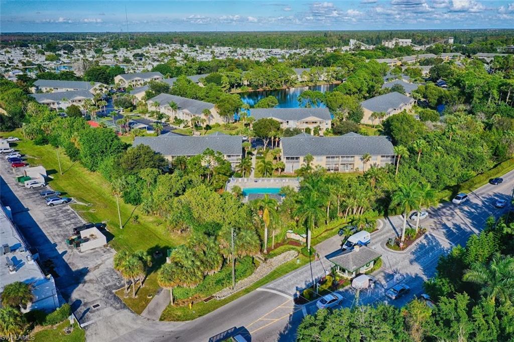 1220 Sarah Jean Circle, Unit L103 Naples, FL 34110 - Photo 19 of 23 view of a city with an ocean